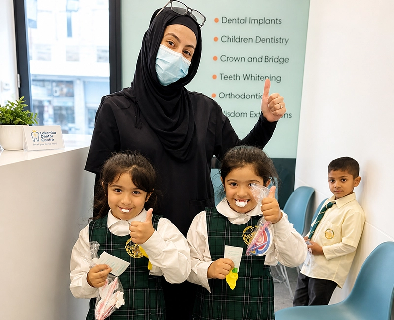 Friendly pediatric dentist checking a child's teeth
